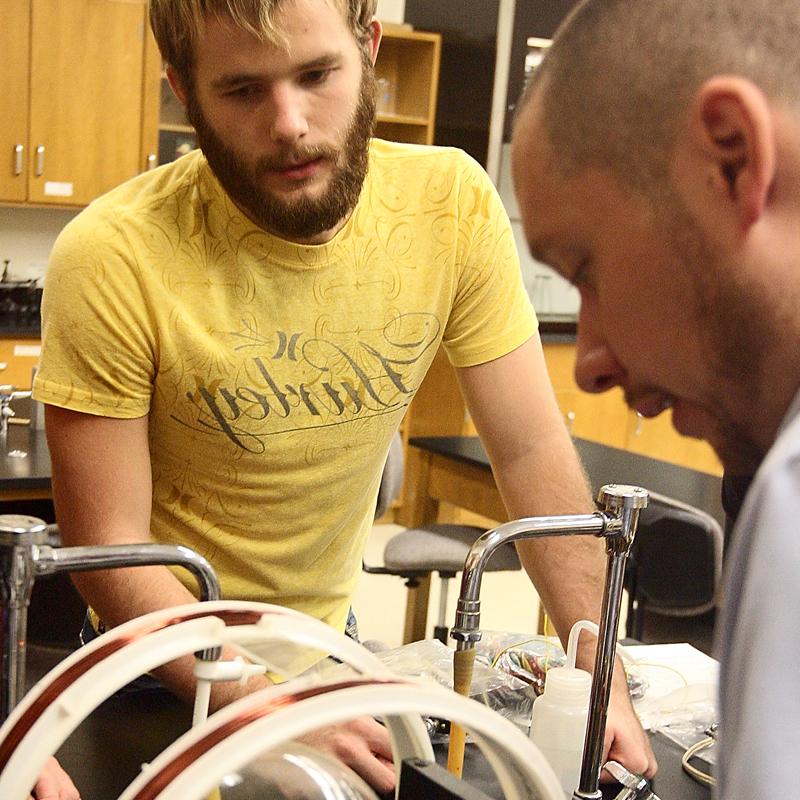 two male students in a college lab